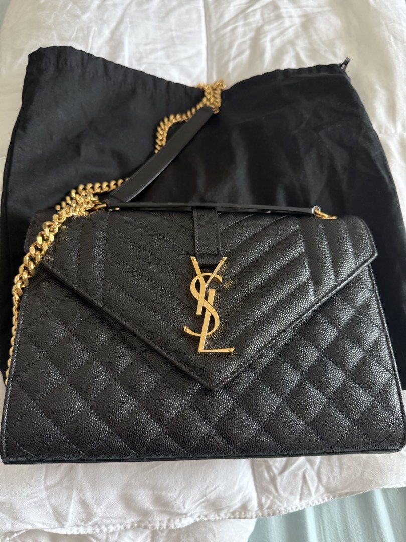 Saint Laurent Envelope Chain Bag (Category: Luxury Bags & Wallets) located in Manila. Submitted by act23 (Listing ID 1423436859, Image 1). Description: AUTHENTIC WITH CERTIFICATE - Saint Laurent Envelope Chain Bag - Black color - Gold-tone hardware - Quilted design - Chain strap - Flap closure with YSL logo - Includes dust bag and card - Black interior .