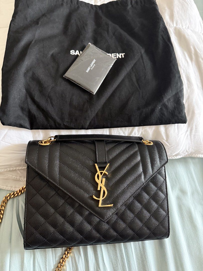 Saint Laurent Envelope Chain Bag (Category: Luxury Bags & Wallets) located in Manila. Submitted by act23 (Listing ID 1423436859, Image 2). Description: AUTHENTIC WITH CERTIFICATE - Saint Laurent Envelope Chain Bag - Black color - Gold-tone hardware - Quilted design - Chain strap - Flap closure with YSL logo - Includes dust bag and card - Black interior .