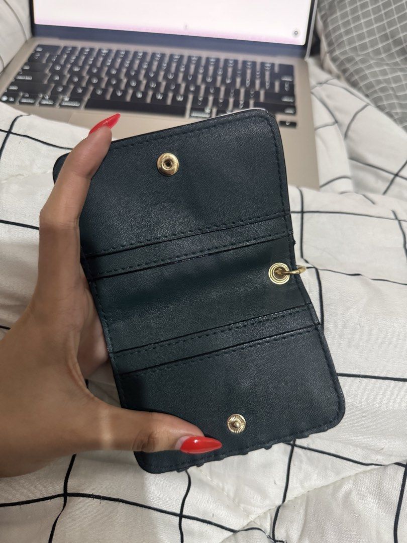 Victoria's Secret Card Holder (Category: Wallets & Card holders) located in San Fernando. Submitted by alt_thea (Listing ID 1423554641, Image 2). Description: - Dark green card holder - Gold-tone key ring - Victoria's Secret logo - Multiple card slots - Clear ID window - Snap closure - Textured material - brand new mop: gcash or bank mod: jrs/lalamove.