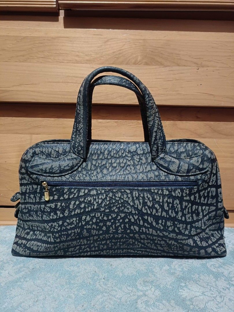 Vintage Antelope Leather Handbag (Category: Luxury Bags & Wallets) located in Baguio. Submitted by roselleshiddentreasures13384 (Listing ID 1423458854, Image 2). Description: -Antelope Leather Material - Stylish handbag - Unique textured pattern - Top handle - Zippered closure - Durable material - Structured shape - Dark color with lighter pattern - Gold-colored zipper.