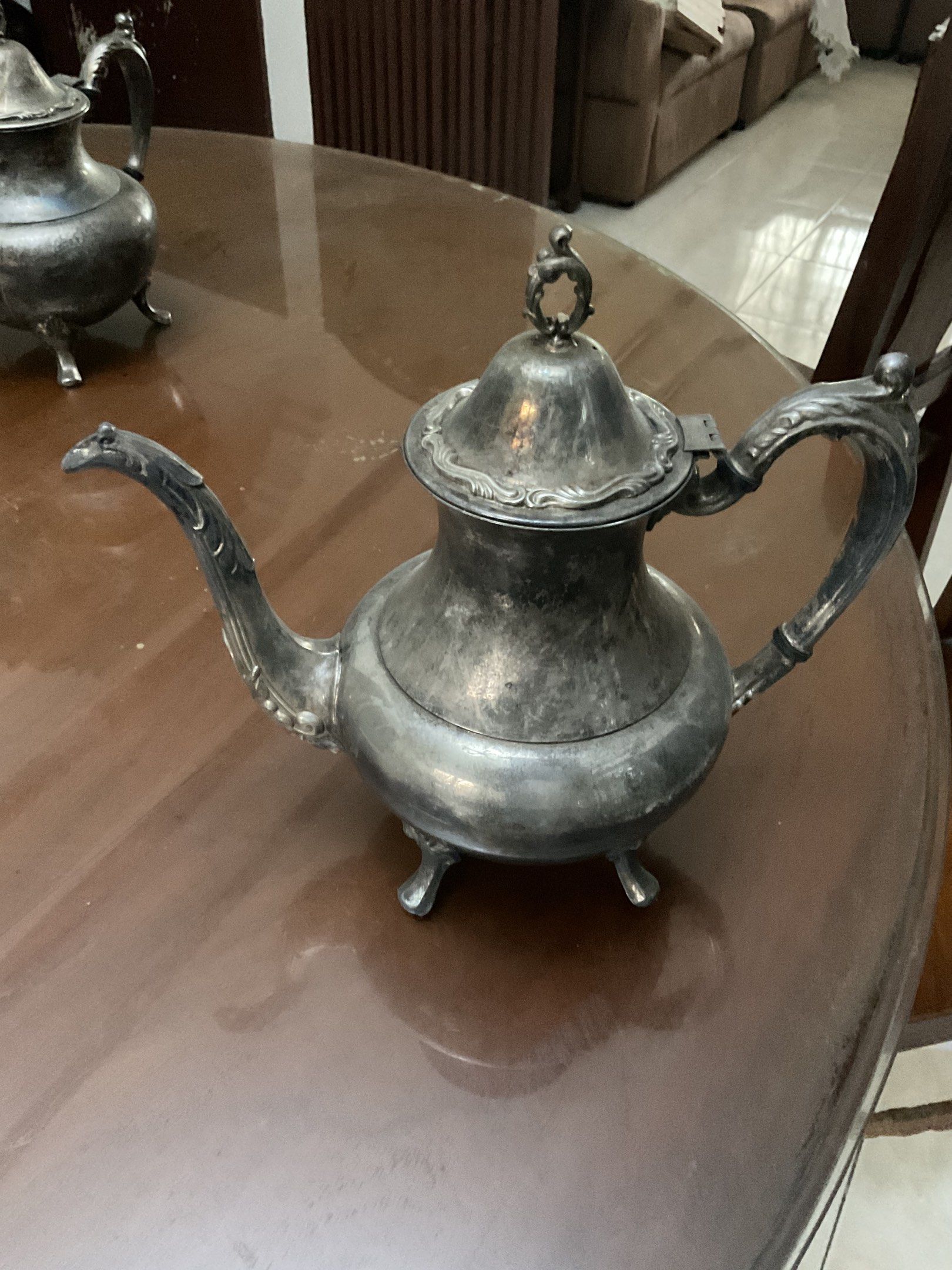 Vintage Silver Teapot (Category: Coffee & Tea Tableware) located in Las Pinas. Submitted by ydnam0815 (Listing ID 1423475719, Image 3). Description: - Elegant vintage silver teapot - Curved spout and ornate handle - Decorative lid - Supported by three small feet - Lid opens - needs polishing 5,000 for both or 2,800 each.