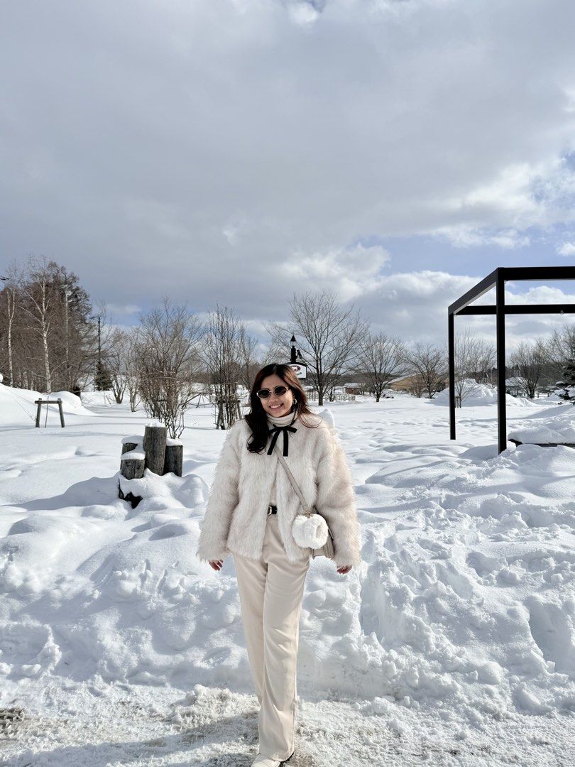 Winter White Fur Coat (not pure white) (Category: Coats, Jackets and Outerwear) located in Davao. Submitted by micahcm (Listing ID 1423461685, Image 1). Description: FOR RENT ONLY: -7 days -Deposit: 500 - Soft, fuzzy white jacket - Features a black bow detaily - Cropped style - Ideal for layering - Suitable for cold weather.