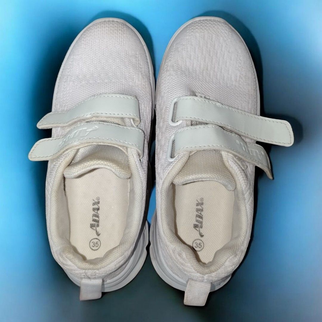 Adax White Velcro Sneakers - Size 35 (Category: Sneakers) located in Manila. Submitted by stuffzz2shop (Listing ID 1423755689, Image 2). Description: Kids Shoes – ADAX Brand 📏 Length: 8 inches 👟 Size: 35 🔄 Can fit adults with size 35 feet ✅Pre-loved but Pristine condition ✅ Washed and clean ✅ Mesh-like material for breathability ⚠️ Minor yellowing in some areas (may removed with thorough cleaning) Payment Methods: 💳 First to pay via GCash or 