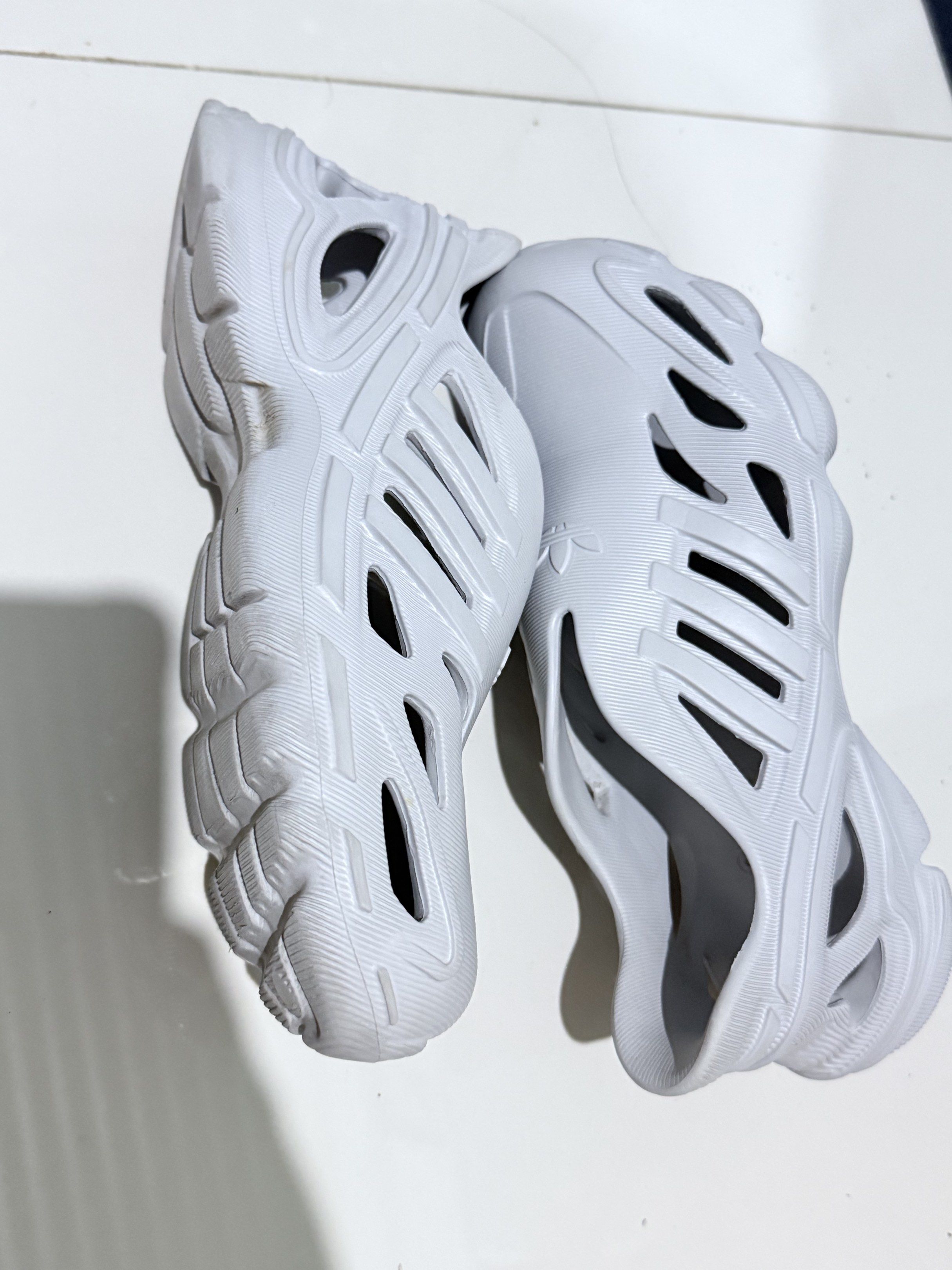 Adidas Adilette Clogs (Category: Slippers & Slides) located in Paranaque City. Submitted by thousandfold (Listing ID 1423727830, Image 1). Description: -Adidas perforated-design slip on sneakers -Adiform Supernova shoes Ang ganda kaso for me need may medyas pag susuotin kasi ung sa may buko buko ng paa parang tight but super gaan Pm ur offer or swap to catfood 😍💖.