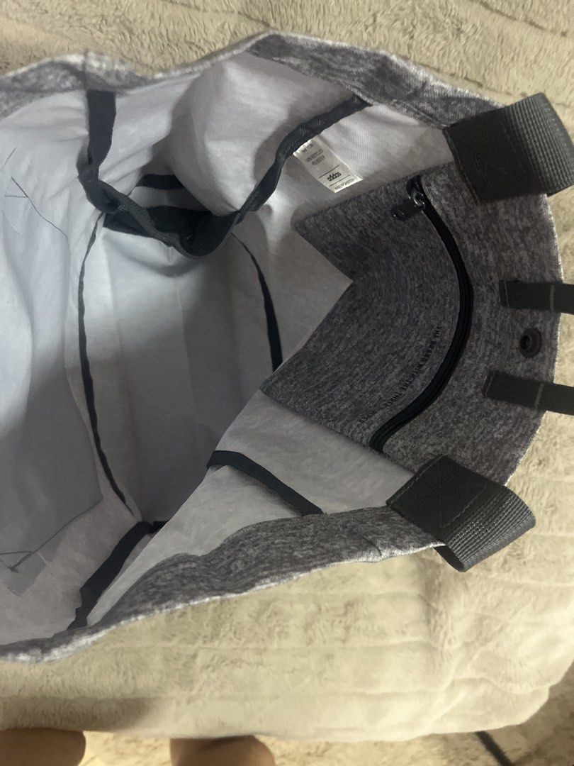 Adidas Tote Bag (Category: Tote Bags) located in Pasig City. Submitted by jundbaptist21 (Listing ID 1423680070, Image 3). Description: - Adidas gray tote bag - Main compartment with inner zipper pocket - Snap closure - Small handle and shoulder straps - Adidas logo on front - Includes original tags -original from U.S.