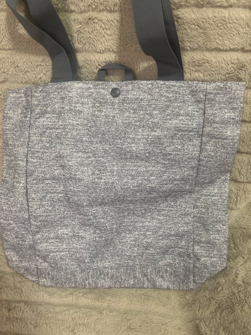 Adidas Tote Bag (Category: Tote Bags) located in Pasig City. Submitted by jundbaptist21 (Listing ID 1423680070, Image 2). Description: - Adidas gray tote bag - Main compartment with inner zipper pocket - Snap closure - Small handle and shoulder straps - Adidas logo on front - Includes original tags -original from U.S.