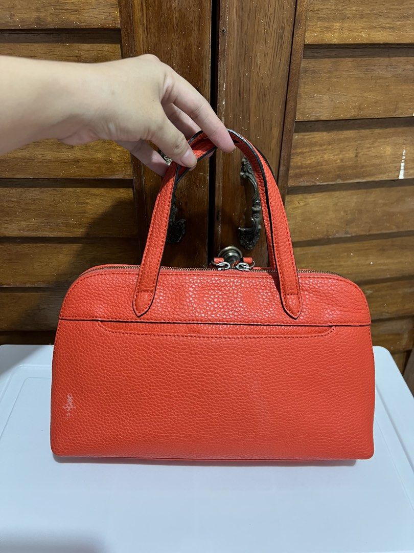 Andiata Orange Handbag (Category: Luxury Bags & Wallets) located in Manila. Submitted by zoeykim16 (Listing ID 1423680470, Image 2). Description: - Andiata orange handbag - Top zipper closure - Two handles - Multiple interior compartments - Textured orange exterior - Minor wear visible.