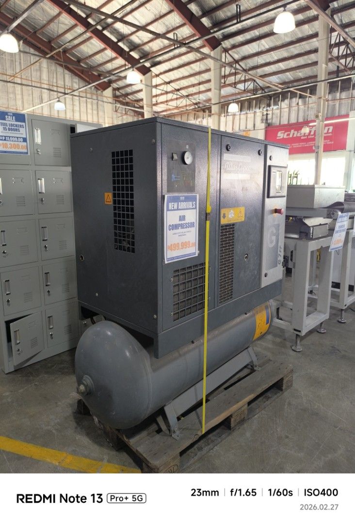 Atlas Copco G7 FF Air Compressor (Category: Construction Tools & Equipment) located in Dasmarinas. Submitted by bossgabo (Listing ID 1423645685, Image 2). Description: - Atlas Copco G7 FF air compressor - Manufactured in 2020 - Grey body with cylindrical tank - Equipped with gauges and control panels - Model number and specifications visible - Mounted on a wooden pallet.