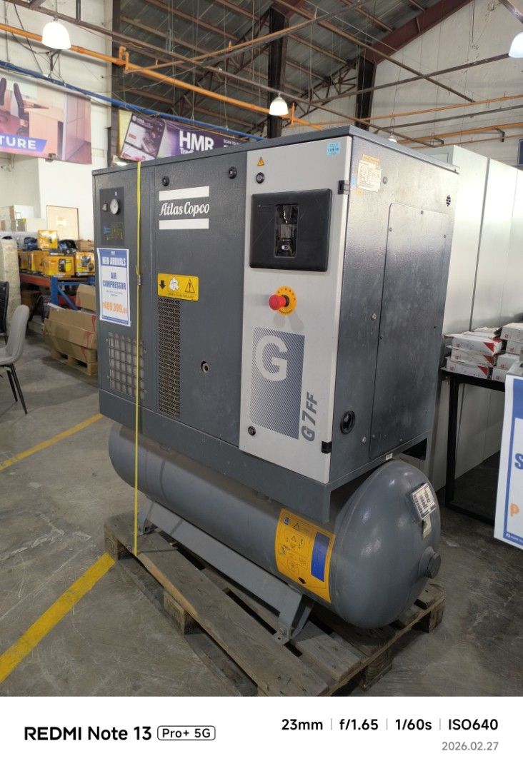 Atlas Copco G7 FF Air Compressor (Category: Construction Tools & Equipment) located in Dasmarinas. Submitted by bossgabo (Listing ID 1423645685, Image 3). Description: - Atlas Copco G7 FF air compressor - Manufactured in 2020 - Grey body with cylindrical tank - Equipped with gauges and control panels - Model number and specifications visible - Mounted on a wooden pallet.