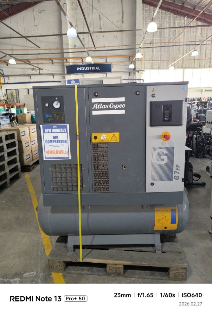Atlas Copco G7 FF Air Compressor (Category: Construction Tools & Equipment) located in Dasmarinas. Submitted by bossgabo (Listing ID 1423645685, Image 1). Description: - Atlas Copco G7 FF air compressor - Manufactured in 2020 - Grey body with cylindrical tank - Equipped with gauges and control panels - Model number and specifications visible - Mounted on a wooden pallet.