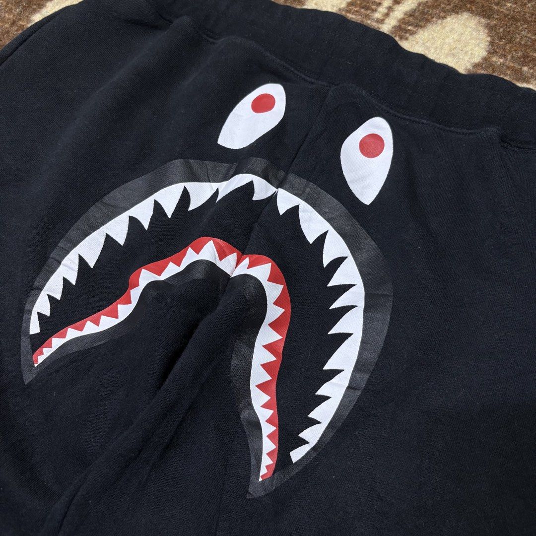 BAPE Shark Shorts - Black - Size L (Category: Shorts) located in Basista. Submitted by yesterdaze.ph (Listing ID 1423773005, Image 2). Description: - BAPE Shark Shorts - Color: Black - Size: L - Cut Washtag/Gold - Iconic shark face design - BAPE tag included - Comfortable material - Perfect for streetwear.