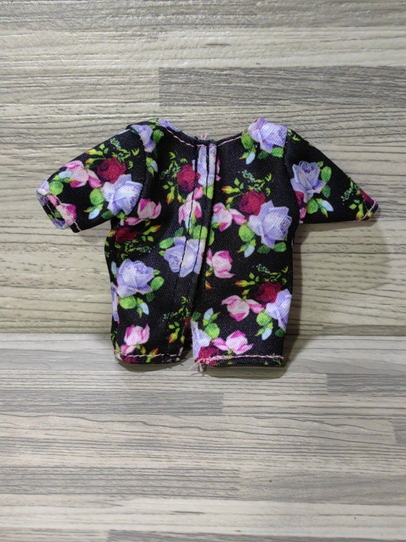 Barbie doll floral top (Category: Blouses) located in Quezon City. Submitted by silverturtle_32df92 (Listing ID 1423745560, Image 2). Description: Original Mattel product not played with, like new no box actual photos what you see is what you get MOP: GCASH, BPI MOD: J&T Express, Lalamove Location: Novaliches, Quezon City.