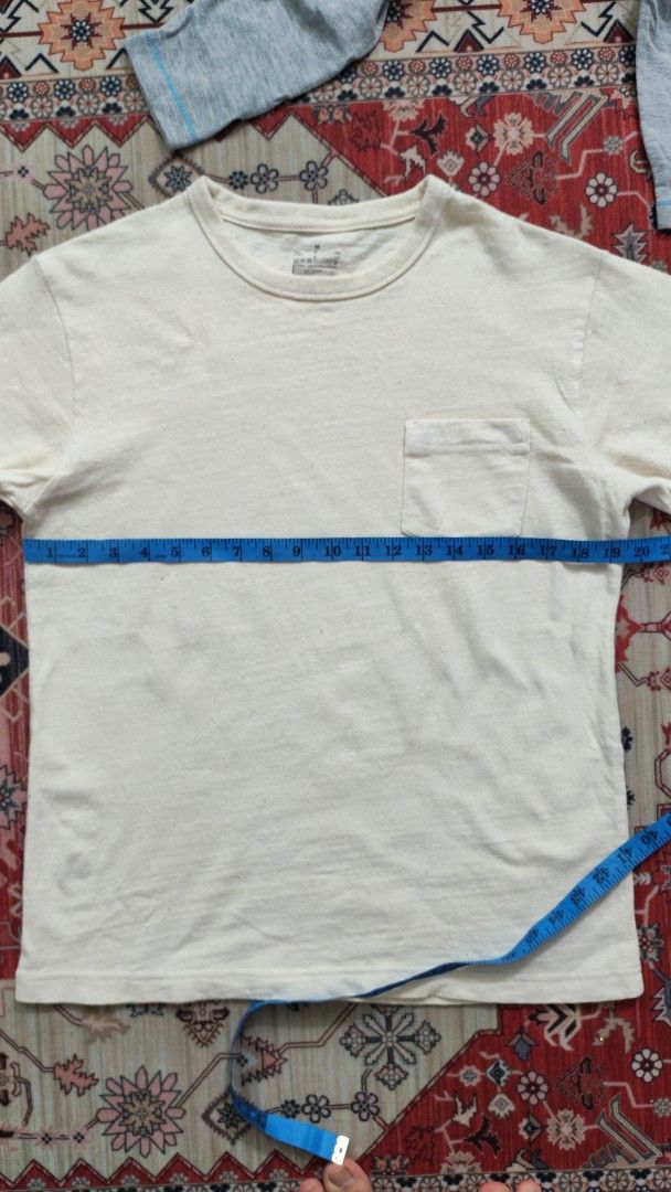 Muji Basic tee (Category: Tshirts & Polo Shirts) located in Tanjong Malim. Submitted by eddzhd (Listing ID 1423771855, Image 3). Description: - Muji -Broken white - Crew neck design - Features a chest pocket - Made from soft, breathable fabric - Measurements available in images - Ideal for casual outfits.