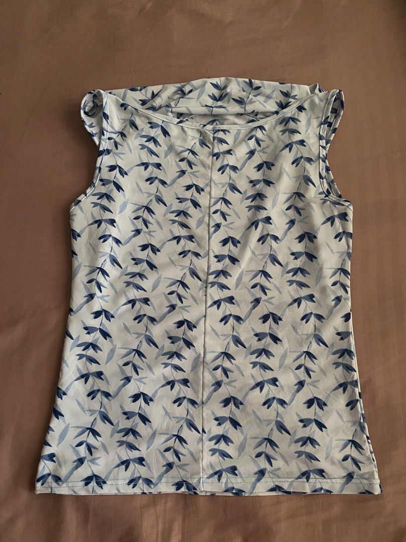 blue cowl neck sleeveless top (Category: Sleeveless) located in Bocaue. Submitted by cleodeclutters (Listing ID 1423721242, Image 3). Description: ☆ thrifted from an ig shop ☆ can be worn in two ways: cowl neck top / one shoulder top mop : gcash, maya, bdo mod : j&t, lalamove message for more details & inquiries ➔ payment first ➔ strictly no return & refund.