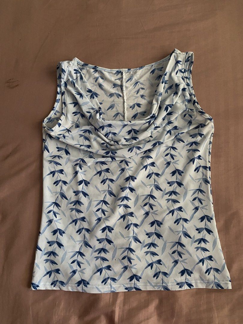 blue cowl neck sleeveless top (Category: Sleeveless) located in Bocaue. Submitted by cleodeclutters (Listing ID 1423721242, Image 1). Description: ☆ thrifted from an ig shop ☆ can be worn in two ways: cowl neck top / one shoulder top mop : gcash, maya, bdo mod : j&t, lalamove message for more details & inquiries ➔ payment first ➔ strictly no return & refund.