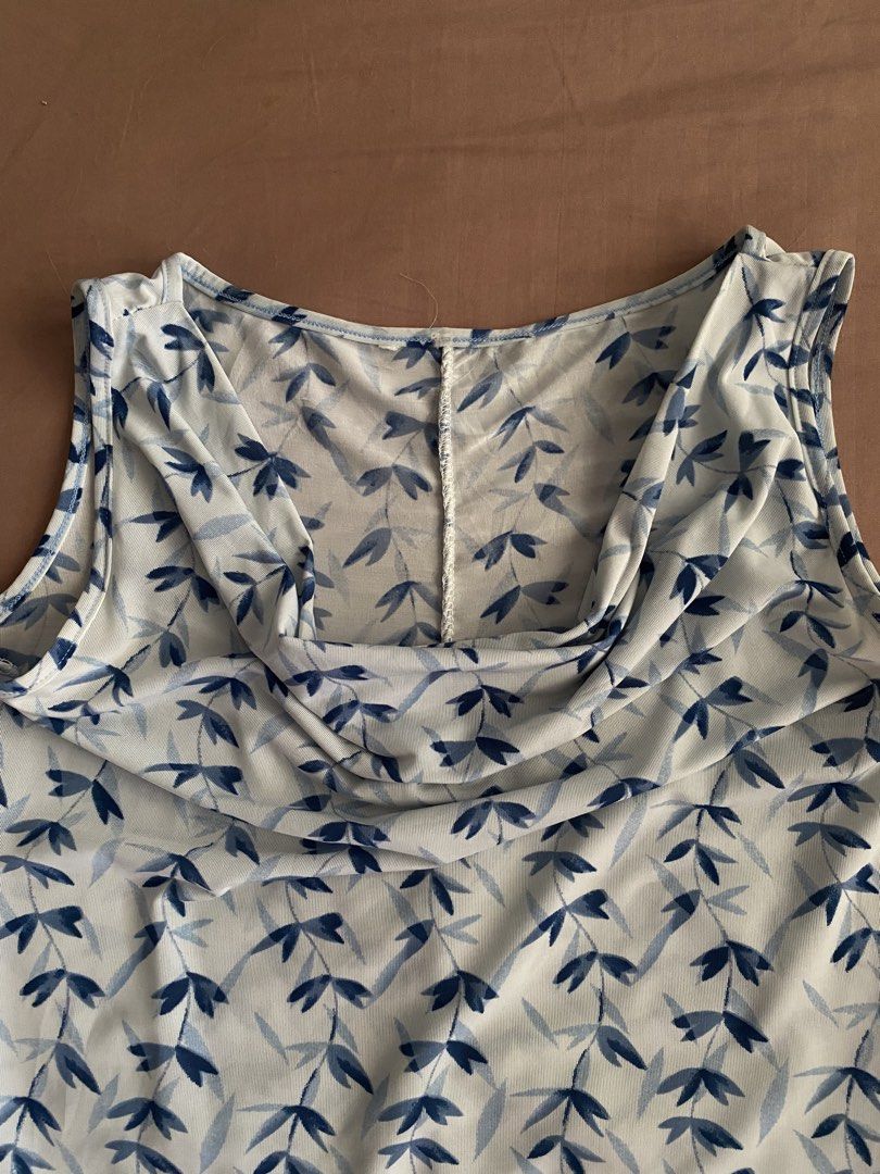 blue cowl neck sleeveless top (Category: Sleeveless) located in Bocaue. Submitted by cleodeclutters (Listing ID 1423721242, Image 2). Description: ☆ thrifted from an ig shop ☆ can be worn in two ways: cowl neck top / one shoulder top mop : gcash, maya, bdo mod : j&t, lalamove message for more details & inquiries ➔ payment first ➔ strictly no return & refund.