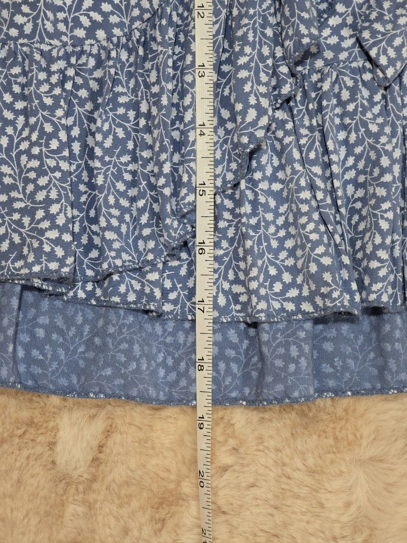 Blue Floral Ruffle Skirt (Category: Skirts) located in Manila. Submitted by luvpeachkachu (Listing ID 1423671838, Image 3). Description: - garterized back - fits small up to 25inched waist.