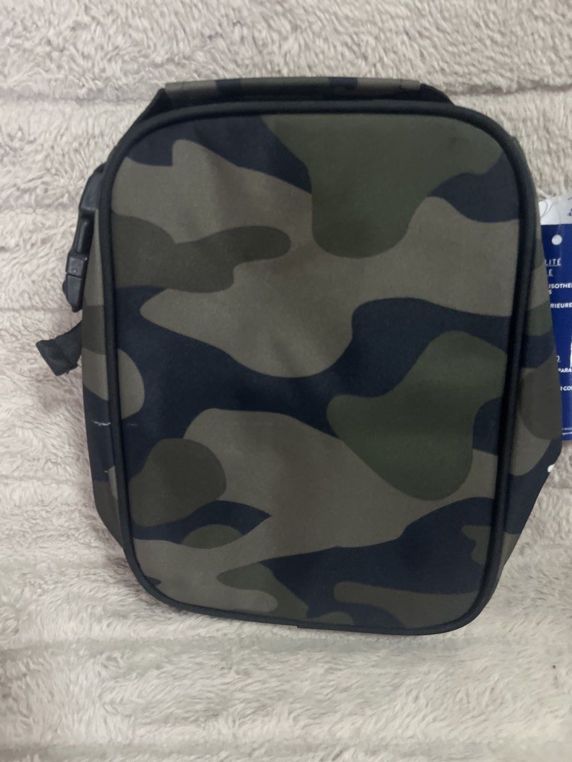 Champion Camo Lunch Bag (Category: Sling Bags) located in Pasig City. Submitted by jundbaptist21 (Listing ID 1423687549, Image 2). Description: - Champion camouflage lunch bag - Insulated interior - Zippered front pocket - Top handle - Black base with Champion logo - Buckle closure on the side - Includes Champion tag -on sale.