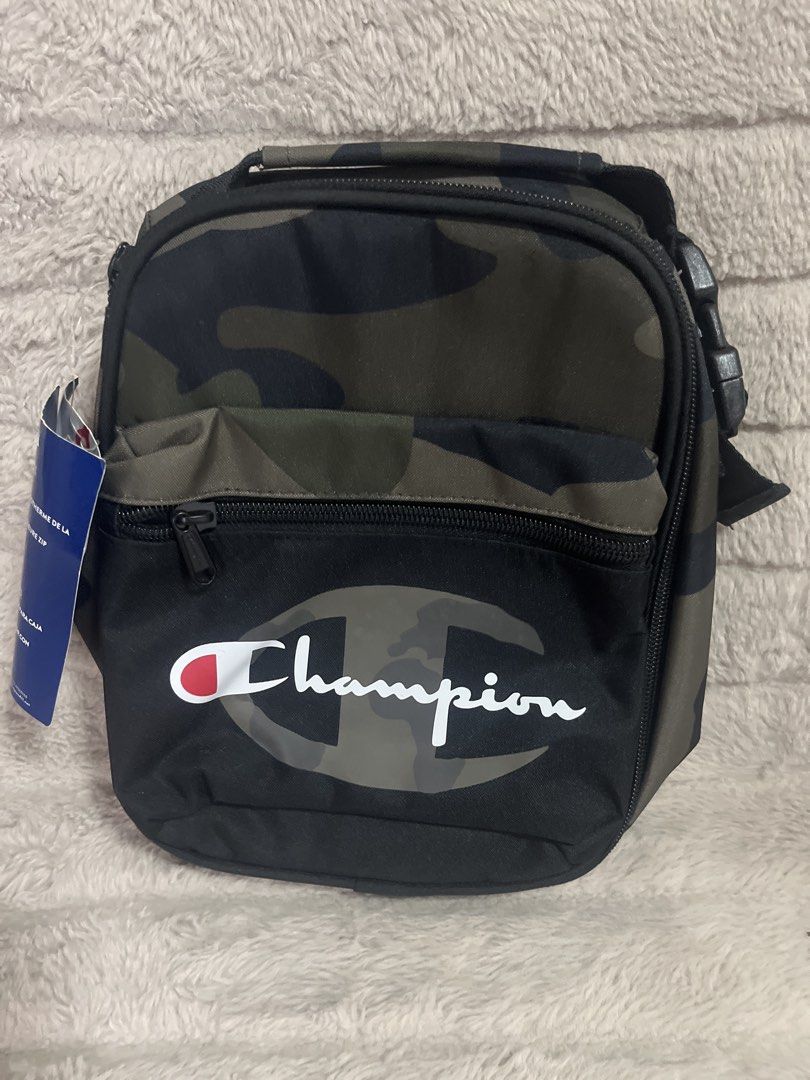 Champion Camo Lunch Bag (Category: Sling Bags) located in Pasig City. Submitted by jundbaptist21 (Listing ID 1423687549, Image 1). Description: - Champion camouflage lunch bag - Insulated interior - Zippered front pocket - Top handle - Black base with Champion logo - Buckle closure on the side - Includes Champion tag -on sale.