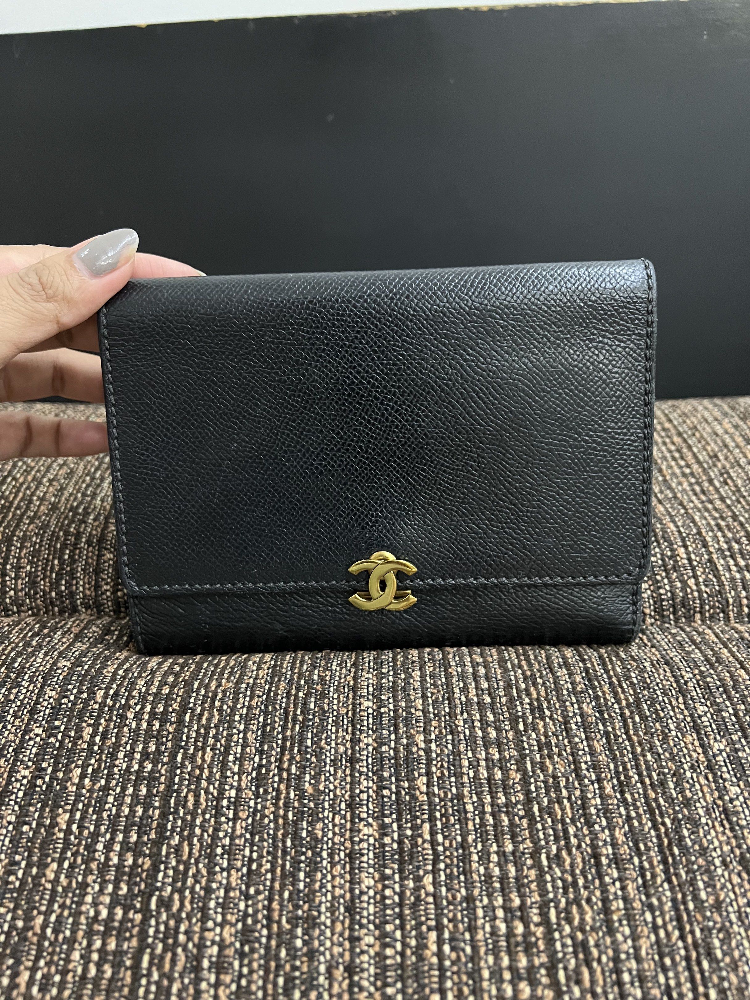 Authentic preloved Chanel Black Leather trifold medium Wallet (Category: Luxury Bags & Wallets) located in San Pablo. Submitted by iamtrina (Listing ID 1423686349, Image 1). Description: - Authentic Chanel wallet - Black leather exterior - Gold-tone interlocking CC logo - Interior: Multiple card slots, zippered compartment - with serial number and japan purchase date sticker - Textured leather finish.