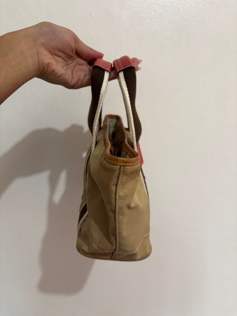 Coach Hampton Mini Weekender Tote Bag (Category: Luxury Bags & Wallets) located in Paranaque City. Submitted by backburnt (Listing ID 1423650219, Image 3). Description: Coach Hampton Mini Weekender Tote Bag (beige/red) - original vintage coach bag, released 2005 - negotiable! - nylon lining - with inner zipper pocket - coach hang tag with daisy - needs cleaning - dm for pics/questions!.