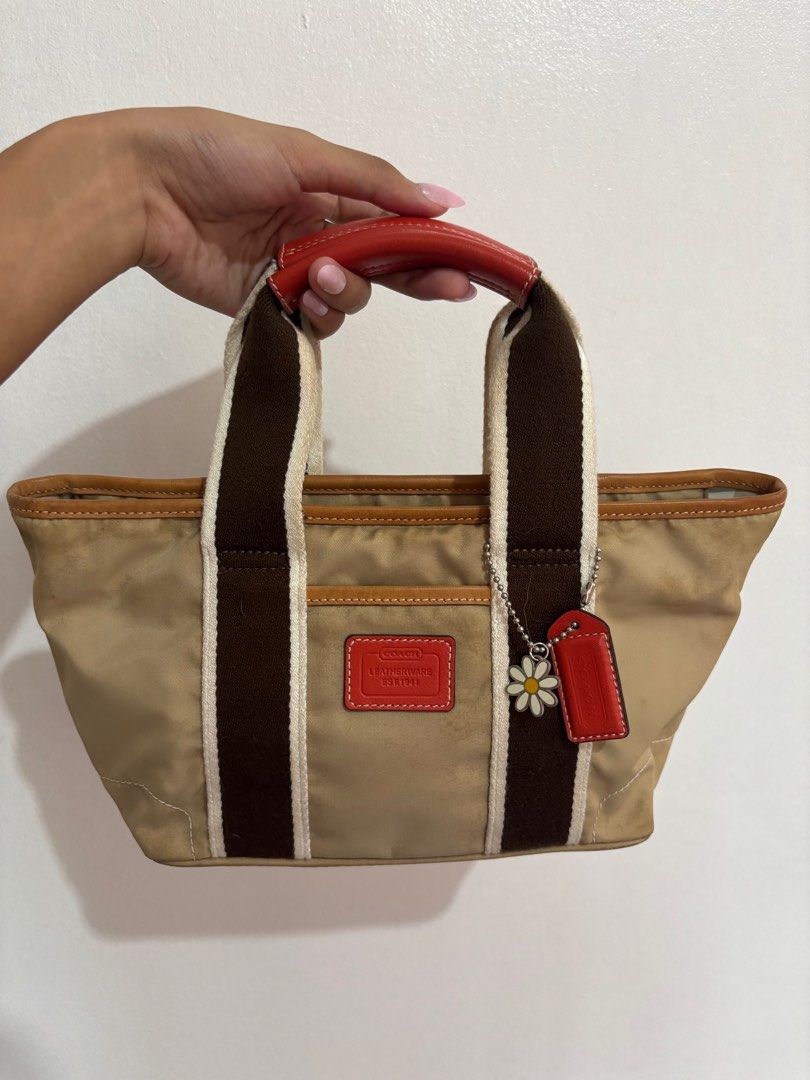 Coach Hampton Mini Weekender Tote Bag (Category: Luxury Bags & Wallets) located in Paranaque City. Submitted by backburnt (Listing ID 1423650219, Image 1). Description: Coach Hampton Mini Weekender Tote Bag (beige/red) - original vintage coach bag, released 2005 - negotiable! - nylon lining - with inner zipper pocket - coach hang tag with daisy - needs cleaning - dm for pics/questions!.