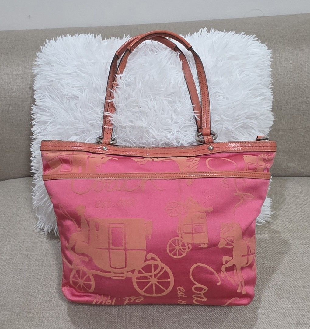 Coach Pink Tote Bag (Category: Luxury Bags & Wallets) located in Dasmarinas. Submitted by m3lbern9s (Listing ID 1423729420, Image 2). Description: - Coach tote bag - Pink color with carriage print - Top zipper closure - Double handles - 100% authentic - Multiple interior pockets - Pink interior lining - Includes a leather tag.