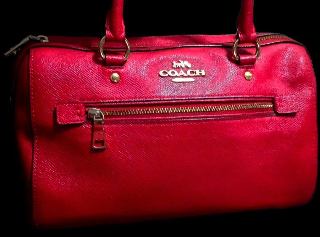 Coach Red Satchel Handbag (Category: Luxury Bags & Wallets) located in Taguig. Submitted by dzkponlineshop (Listing ID 1423675291, Image 1). Description: - Authentic Coach satchel handbag - Color: Red - Features: - Top zipper closure - Front zipper pocket - Dual top handles - Detachable shoulder strap - Gold-toned hardware - Structured shape - Coach logo visible Note: Mini Benette Coach Bag. Thjs is Original gift ng sister ko. Am not using anymor