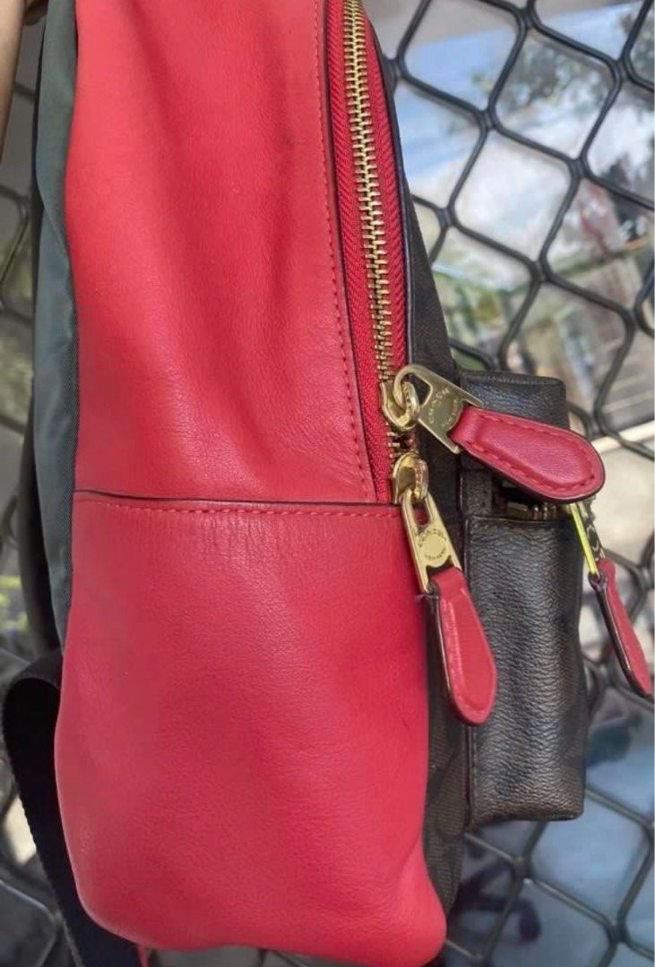 Coach Signature Backpack (Category: Luxury Bags & Wallets) located in Pasig City. Submitted by karenrules (Listing ID 1423617219, Image 2). Description: - Authentic Coach backpack - Signature brown pattern with red accents - Front pocket with gold zipper - Red interior - Gold zippers - Red leather detailing on sides - Interior zippered pocket - Includes Coach tag.