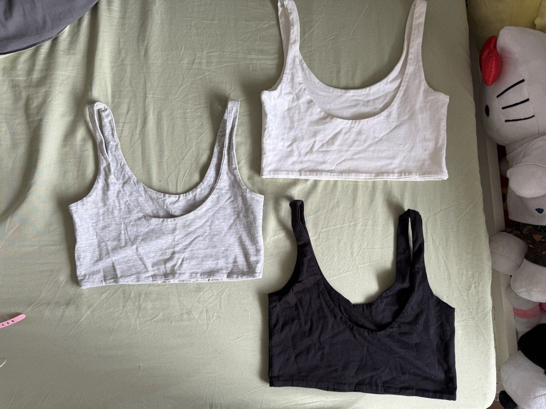 Cotton On Tank Tops Bra (Category: Sleeveless) located in Imus. Submitted by kivecart (Listing ID 1423674784, Image 2). Description: SOLD AS SET - Set of 3 Cotton On tank tops (XS size) - Colors: White (minor stains), black, and grey - Design: Scoop neck - Made in Bangladesh Loc: Imus Cavite MOP: Gcash/BPI MOD: Lalamove/J&T .