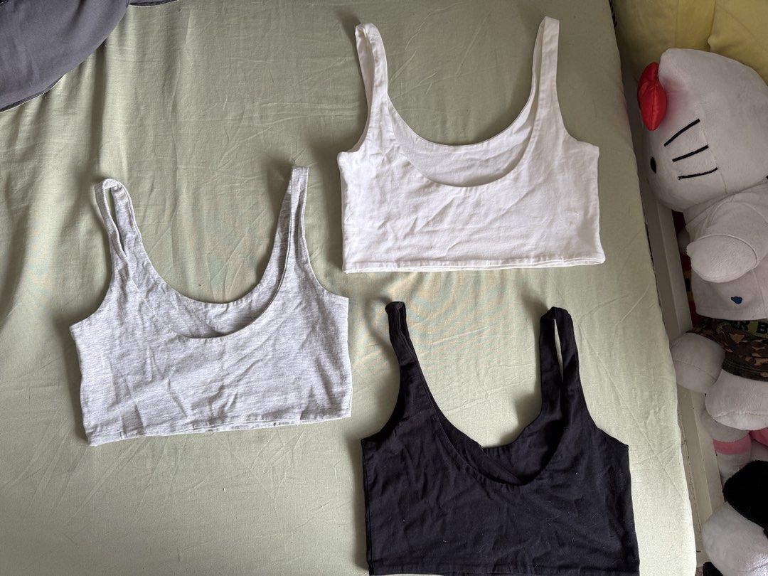 Cotton On Tank Tops Bra (Category: Sleeveless) located in Imus. Submitted by kivecart (Listing ID 1423674784, Image 3). Description: SOLD AS SET - Set of 3 Cotton On tank tops (XS size) - Colors: White (minor stains), black, and grey - Design: Scoop neck - Made in Bangladesh Loc: Imus Cavite MOP: Gcash/BPI MOD: Lalamove/J&T .