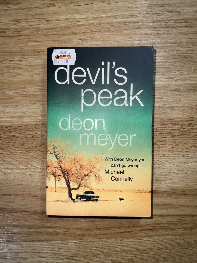 Devil's Peak by Deon Meyer (Category: Storybooks) located in Makati City. Submitted by m9rtha (Listing ID 1423639599, Image 1). Description: - Devil's Peak by Deon Meyer - Published by Hodder - Cover: Desert landscape with car and tree - Includes back cover synopsis and quotes - Price: £6.99.