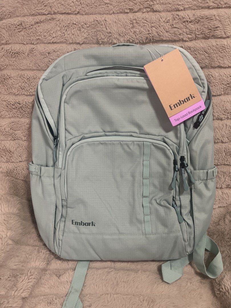 Embark Top-Load Backpack (Category: Backpacks) located in Pasig City. Submitted by jundbaptist21 (Listing ID 1423685371, Image 1). Description: - Light blue Embark backpack - Multiple compartments for organized storage - Top-load design - Side pockets - Padded shoulder straps - Reflective strip for safety - Interior pockets for organization -FROM U.S 🇺🇸.