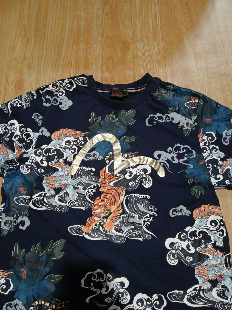 EVISU Custom Made Tiger Print T-shirt (Category: Tshirts & Polo Shirts ) located in Baguio. Submitted by shrrylsales (Listing ID 1423718031, Image 3). Description: - EVISU custom-made T-shirt - Size: L - Color: Navy blue - Design: Unique tiger print (tigers, clouds, floral elements) - Neckline: Crew neck - Sleeves: Short sleeves - Features: Custom-made.