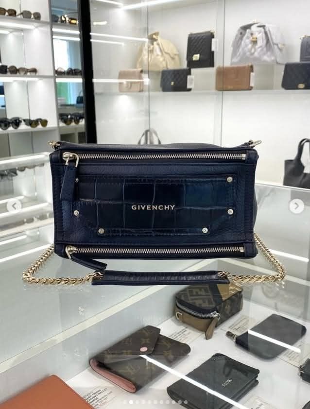 Givenchy Pandora Box Shoulder Bag (Category: Luxury Bags & Wallets) located in Quezon City. Submitted by barbosac (Listing ID 1423764969, Image 1). Description: - Givenchy Pandora Box shoulder bag - Navy blue color - Chain strap - Crocodile-embossed leather panel - Rectangular shape - Multiple zippers - Givenchy logo - Spacious interior.