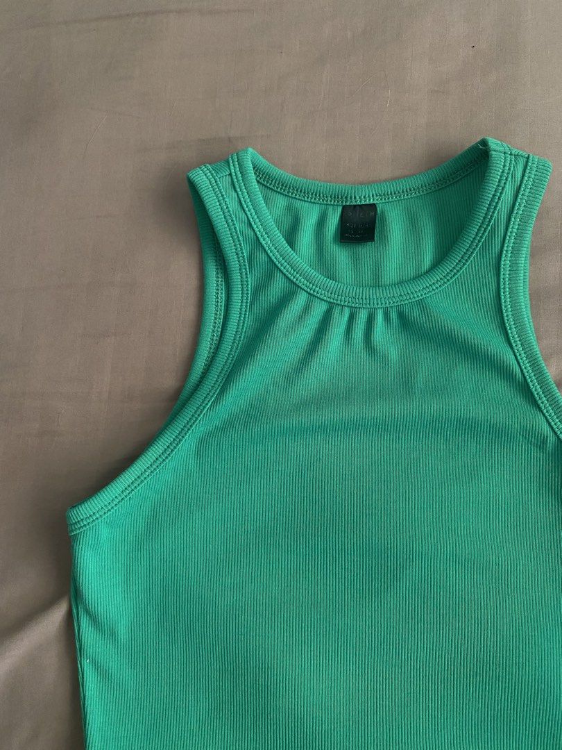 green racerback croptop (Category: Sleeveless) located in Bocaue. Submitted by cleodeclutters (Listing ID 1423721547, Image 2). Description: ☆ color may vary due to lighting ☆ mop : gcash, maya, bdo mod : j&t, lalamove message for more details & inquiries ➔ payment first ➔ strictly no return & refund.