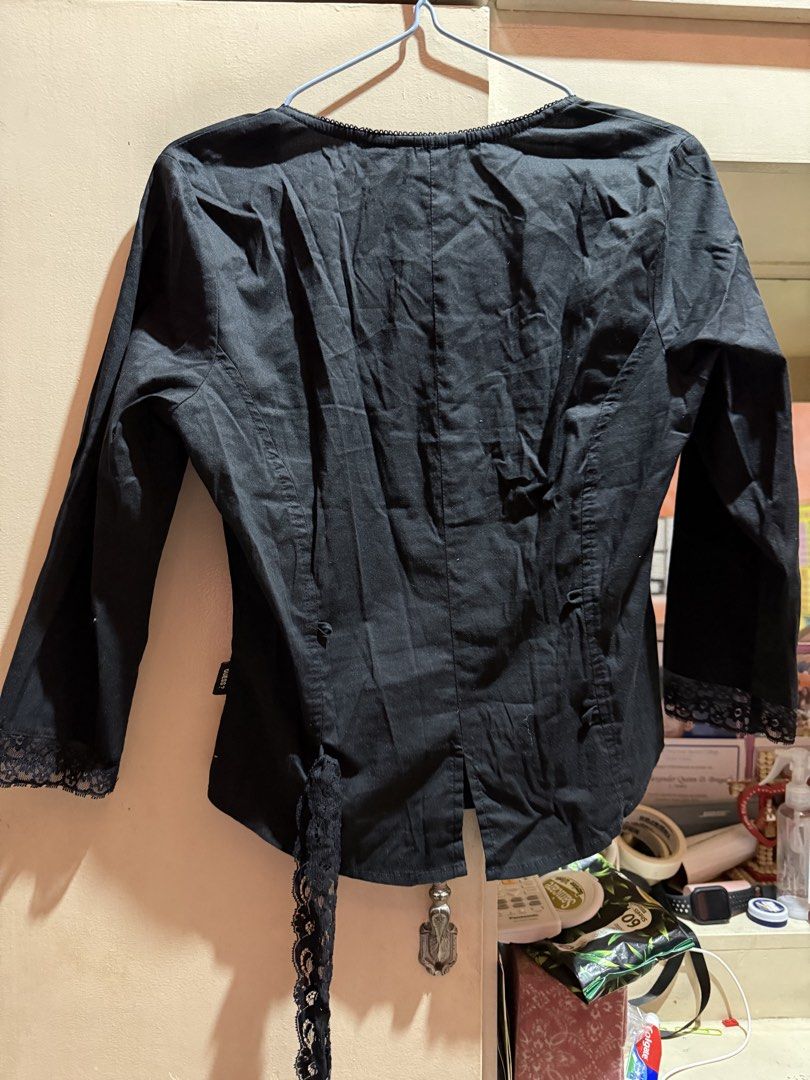 Guess Jeans Black Blouse - Size L (Category: Blouses) located in Manila. Submitted by md2897 (Listing ID 1423759926, Image 3). Description: - Guess Jeans black blouse - Size L - Scoop neckline - Long sleeves with lace cuffs - Button-down front with pleated detailing - Lace tie back detail - Made of stretch material.