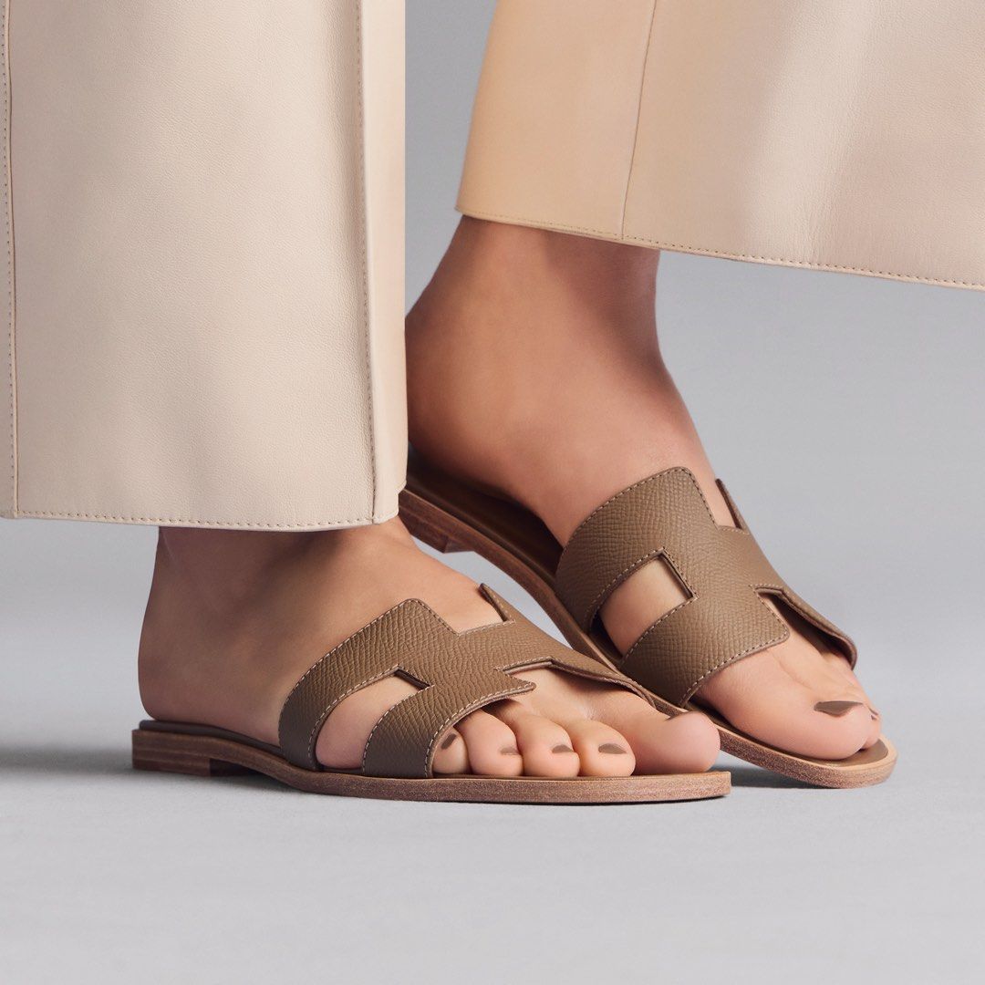 Hermes Box with Ribbon (Category: Flats) located in Kuala Lumpur. Submitted by abbychew_8179 (Listing ID 1423679434, Image 3). Description: Authentic Hermes Oran sandals Neutral brown color Iconic H cut-out design Includes dust bags brand new with full receipt .