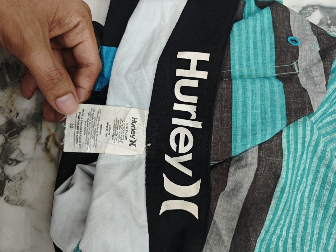 Hurley Striped Board Shorts Size 32 (Category: Swim Trunks & Board Shorts) located in Bolinao. Submitted by rcrh123 (Listing ID 1423728076, Image 3). Description: - Hurley board shorts - Size 32-34west 18length - Striped design: blue, gray, teal - Hurley logo detail - Drawstring closure.