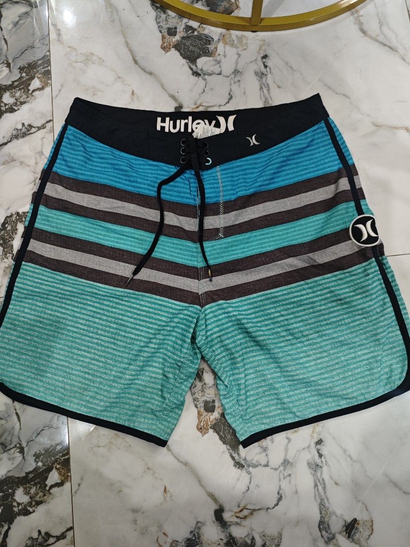 Hurley Striped Board Shorts Size 32 (Category: Swim Trunks & Board Shorts) located in Bolinao. Submitted by rcrh123 (Listing ID 1423728076, Image 1). Description: - Hurley board shorts - Size 32-34west 18length - Striped design: blue, gray, teal - Hurley logo detail - Drawstring closure.