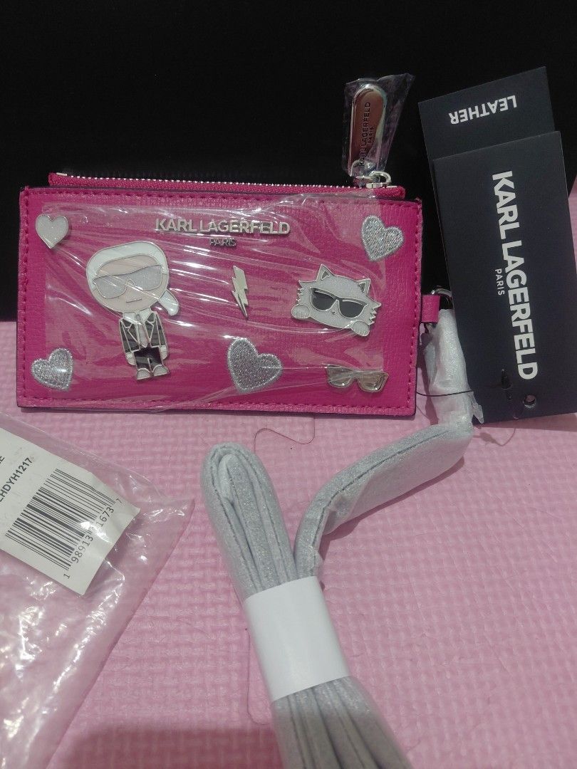 KARL LAGERFIELD CARD PURSE (Category: Luxury Bags & Wallets) located in Manila. Submitted by bashamylove0116 (Listing ID 1423771851, Image 2). Description: - Authentic Karl Lagerfeld Card Purse - Vibrant pink color - Includes original tags - Comes with a shoulder strap - Features a fun Karl Lagerfeld design - Perfect for cards and essentials.