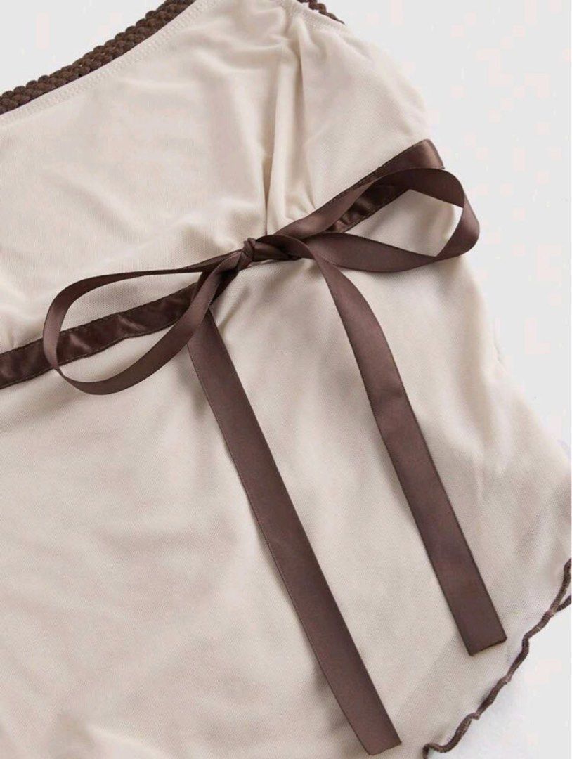 Khaki Assymetrical Hem Bow Tank Top (Category: Sleeveless) located in Pasig City. Submitted by anya2000 (Listing ID 1423736015, Image 3). Description: Khaki Assymetrical Hem Bow Tank Top Earthy Women's Top use once only ( 2hrs).