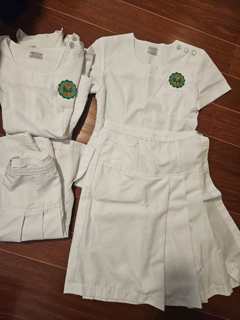 La Salle HSI White OT Uniform Set (Category: Sets or Coordinates) located in Las Pinas. Submitted by lhan20 (Listing ID 1423645980, Image 1). Description: - White OT uniform 4sets - Includes top and skirt - Features green and gold emblem on top - Made of sturdy white fabric - Skirt with pleats - Top has shoulder buttons.