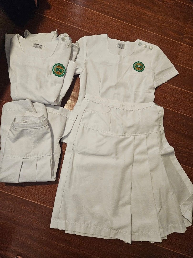 La Salle HSI White OT Uniform Set (Category: Sets or Coordinates) located in Las Pinas. Submitted by lhan20 (Listing ID 1423645980, Image 2). Description: - White OT uniform 4sets - Includes top and skirt - Features green and gold emblem on top - Made of sturdy white fabric - Skirt with pleats - Top has shoulder buttons.