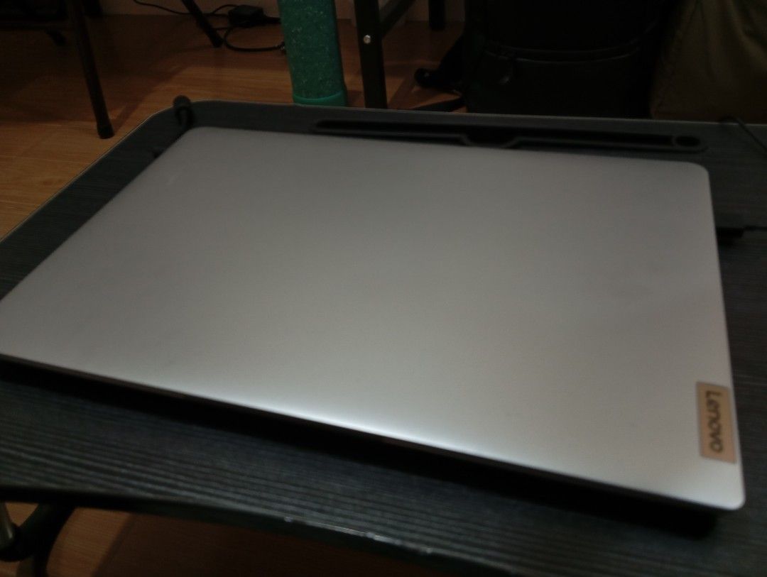 Lenovo IdeaPad Slim 1 (15ALC7) (Category: Laptops & Notebooks) located in Caloocan City. Submitted by arjay_bernarte (Listing ID 1423619395, Image 2). Description: - Lenovo IdeaPad Slim 1 (15ALC7) - AMD Ryzen 5 processor - 8GB RAM - 256GB SSD - Integrated AMD Radeon Graphics - Cloud Grey color - Includes original box - 15-inch screen.