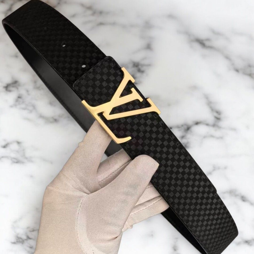 Louis Vuitton LV Belt (Category: Luxury Accessories) located in Manila. Submitted by smokey.holy (Listing ID 1423627109, Image 1). Description: Black belt with gold LV buckle. Checkered pattern. Leather material. Includes box and dust bag. A classic and stylish accessory. 44 INCHES LENGTH 💌DM FORE MORE INFO 📍MANILA.