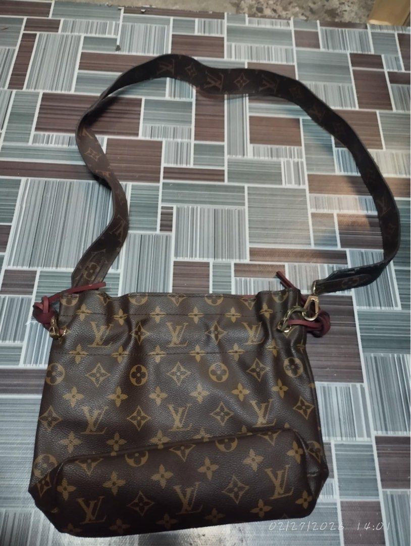 Louis Vuitton Monogram Shoulder Bag (Category: Luxury Bags & Wallets) located in Victorias. Submitted by lan1877 (Listing ID 1423665415, Image 2). Description: - Authentic Louis Vuitton shoulder bag - Iconic Monogram pattern - Drawstring closure - Comfortable shoulder strap - Interior lined with pink fabric - Includes "LOUIS VUITTON PARIS made in France" leather tag - Date code: SF3188.