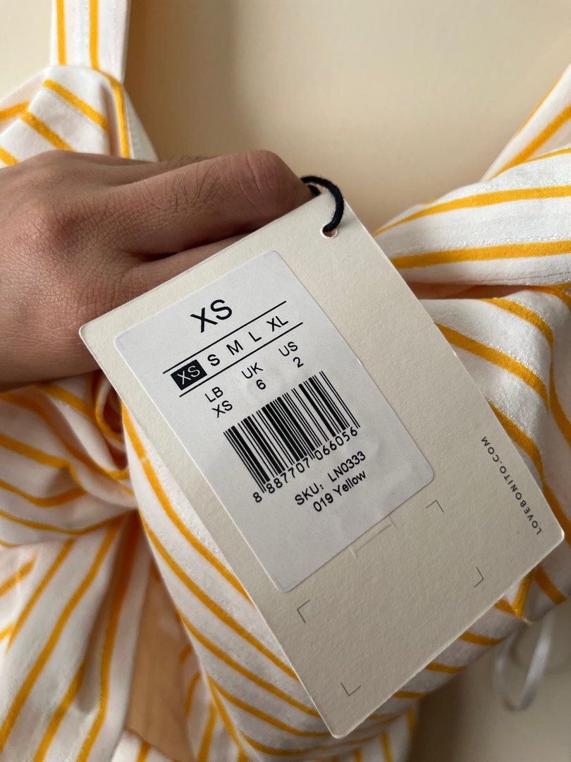 Love, Bonito Striped Jumpsuit (Category: Jumpsuits) located in Pasig City. Submitted by kimcbrl (Listing ID 1423695047, Image 3). Description: - Love, Bonito jumpsuit - Yellow and white striped pattern - Size: XS - Bow detail at bust - Wide straps - Cropped leg length - Lightweight fabric - Perfect for warm weather - Back zipper closure.