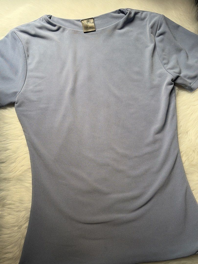 Mera Renata Premium Stone Blue Fitted Top (Category: Shirts) located in Manila. Submitted by chizym (Listing ID 1423630818, Image 2). Description: - Stone blue fitted top - Short sleeves - Round neckline - Stretchy, form-fitting fabric - Simple and elegant design - Versatile for various occasions.