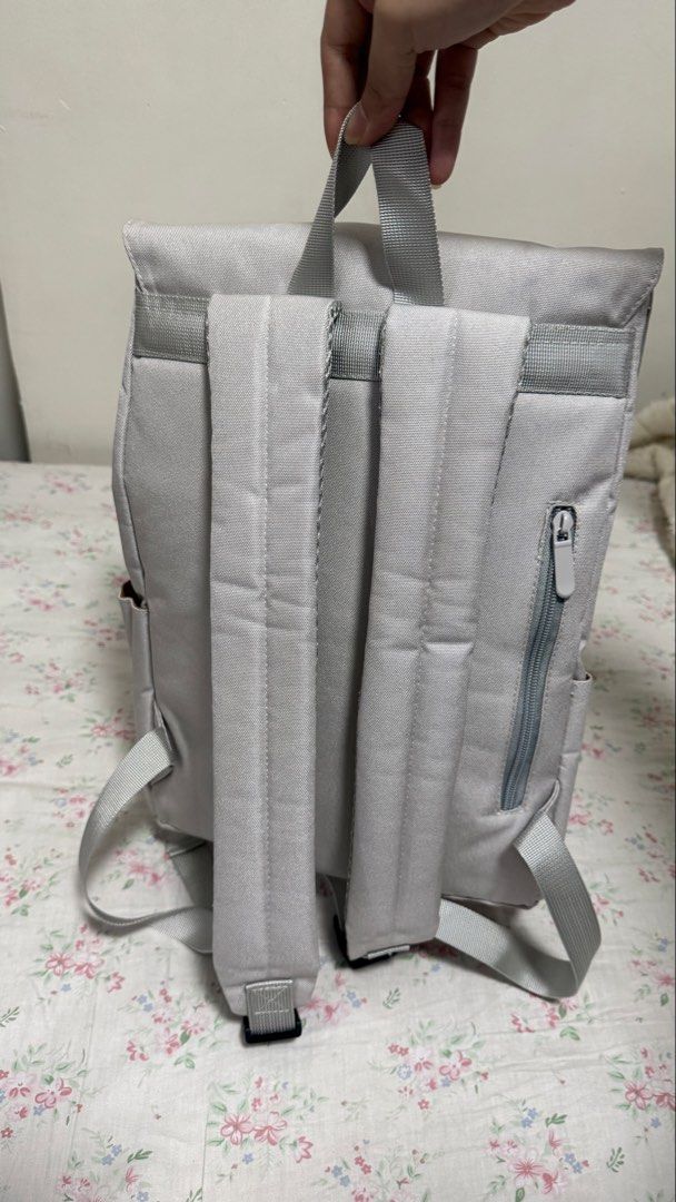 Murioki Grey Backpack (Category: Backpacks) located in Valenzuela. Submitted by .manel. (Listing ID 1423757922, Image 3). Description: Brand New just unboxed it to promote in black app. Selling it a little bit lower. AGAIN THIS IS BRAND NEW and auto pass and no to hagglers. Grey backpack features a flap closure with a buckle and a top handle. It has two side pockets and adjustable shoulder straps. The interior has multiple compartments and a zipp
